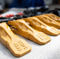 Коронки и ножи на ковш: как выбрать для разных типов грунта